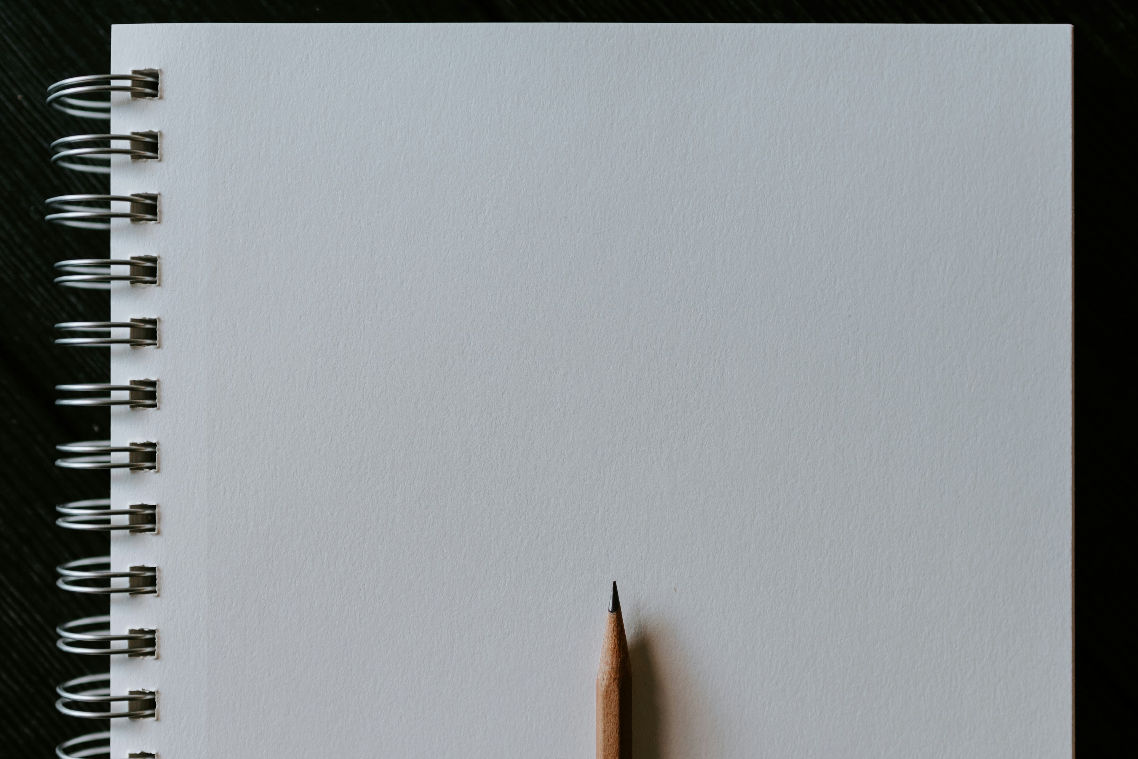 Blank notebook with pencil representing a fresh start